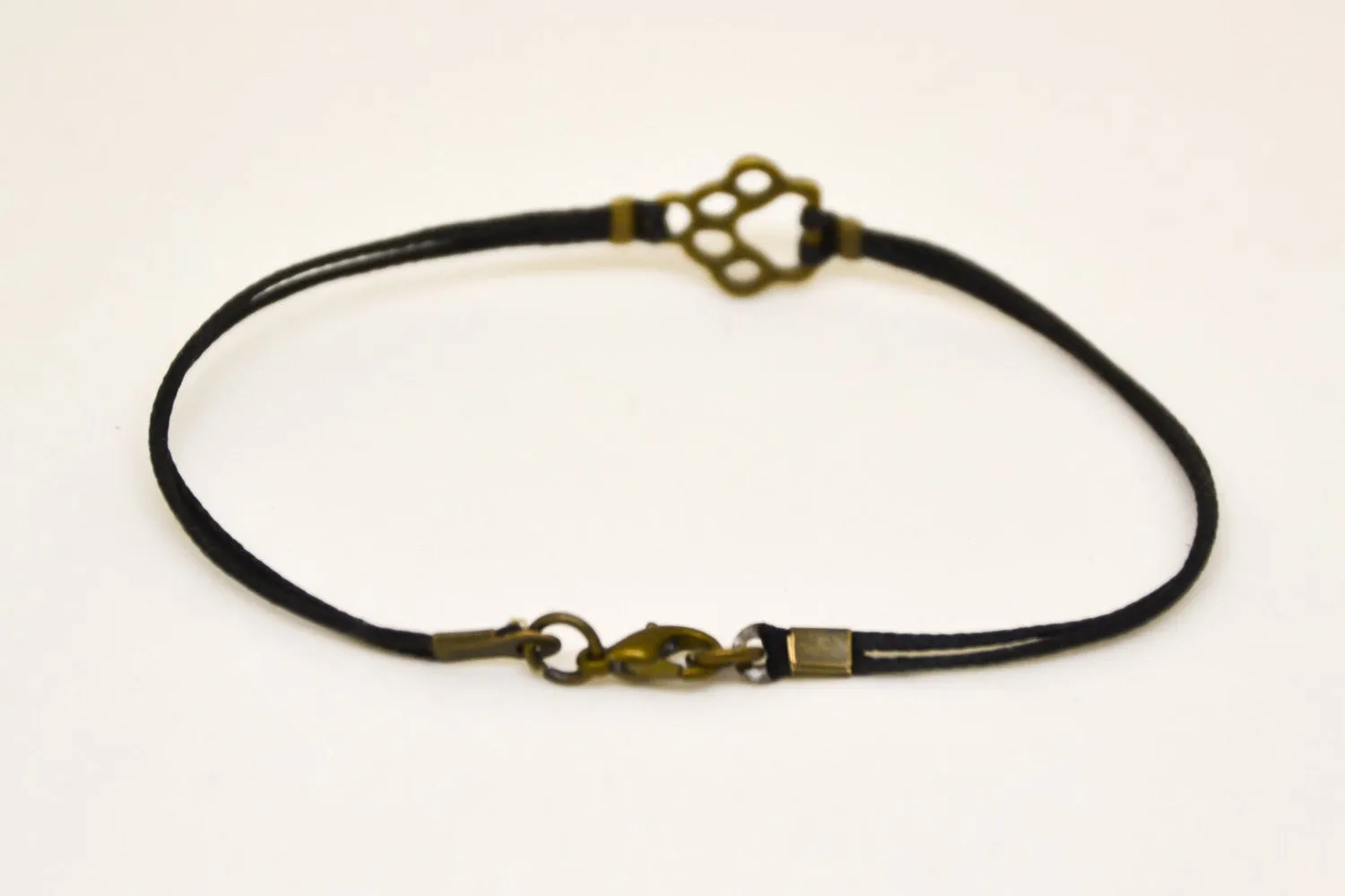 Bronze paw charm bracelet for men, black cord, gift for him