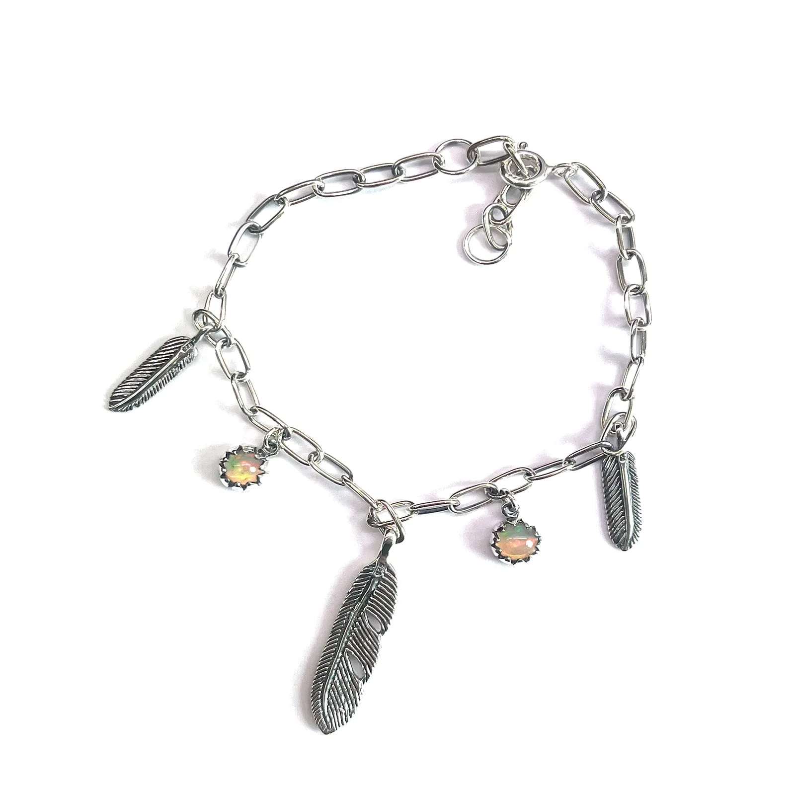 Silver bracelet with  opal & feather